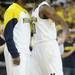 Michigan sophomore Tim Hardaway Jr. chest bumps senior Corey Person as he exits the floor for a time out in the second half against Northwestern at Crisler Center on Wedensday. Melanie Maxwell I AnnArbor.com